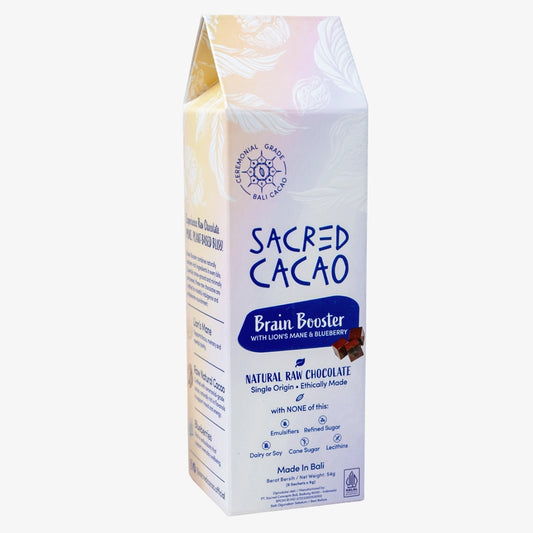 Carton of Sacred Cacao Brain Booster chocolate on a white background. Angle view.